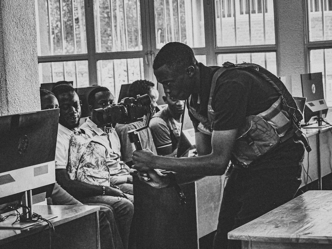 man teaching children