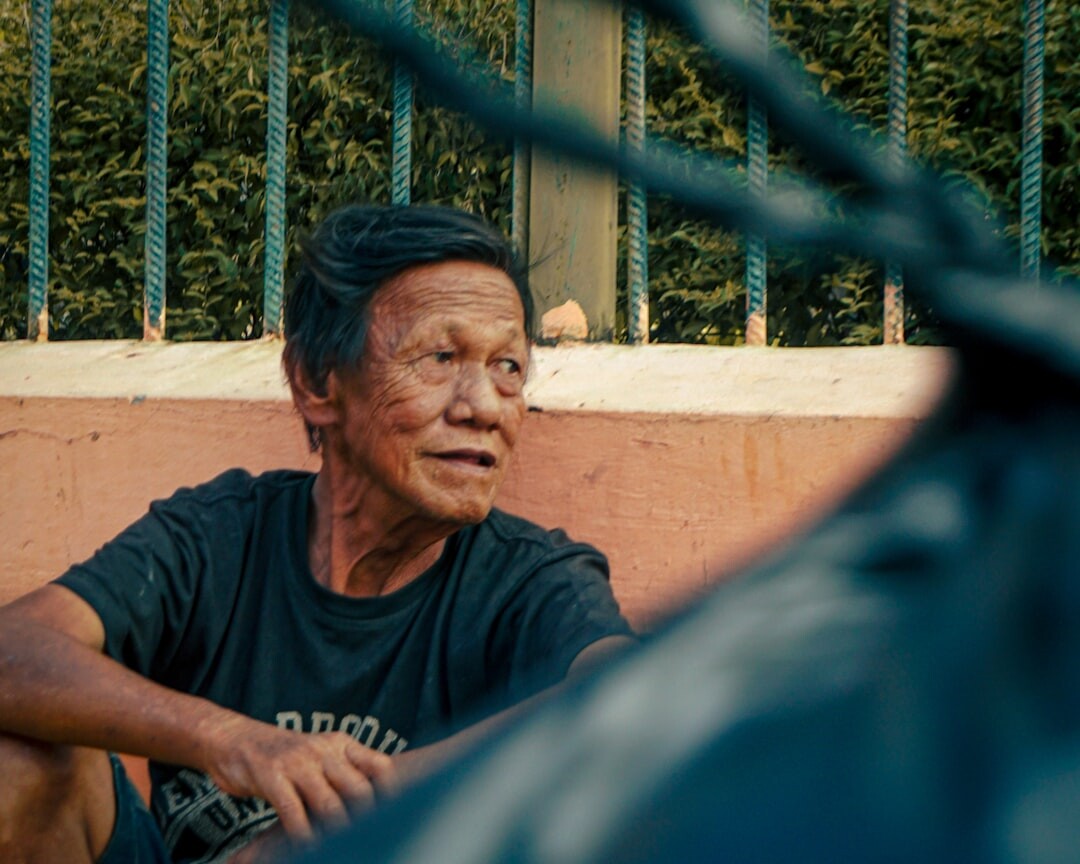 elderly man talking to neighbor